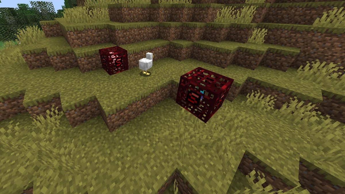 Two player spawners in the Wilderness, recognisable by their red cage and the ScandiCraft S: on the left, the animal spawner has just spawned a chicken; on the right, the monster spawner shows its zombie.